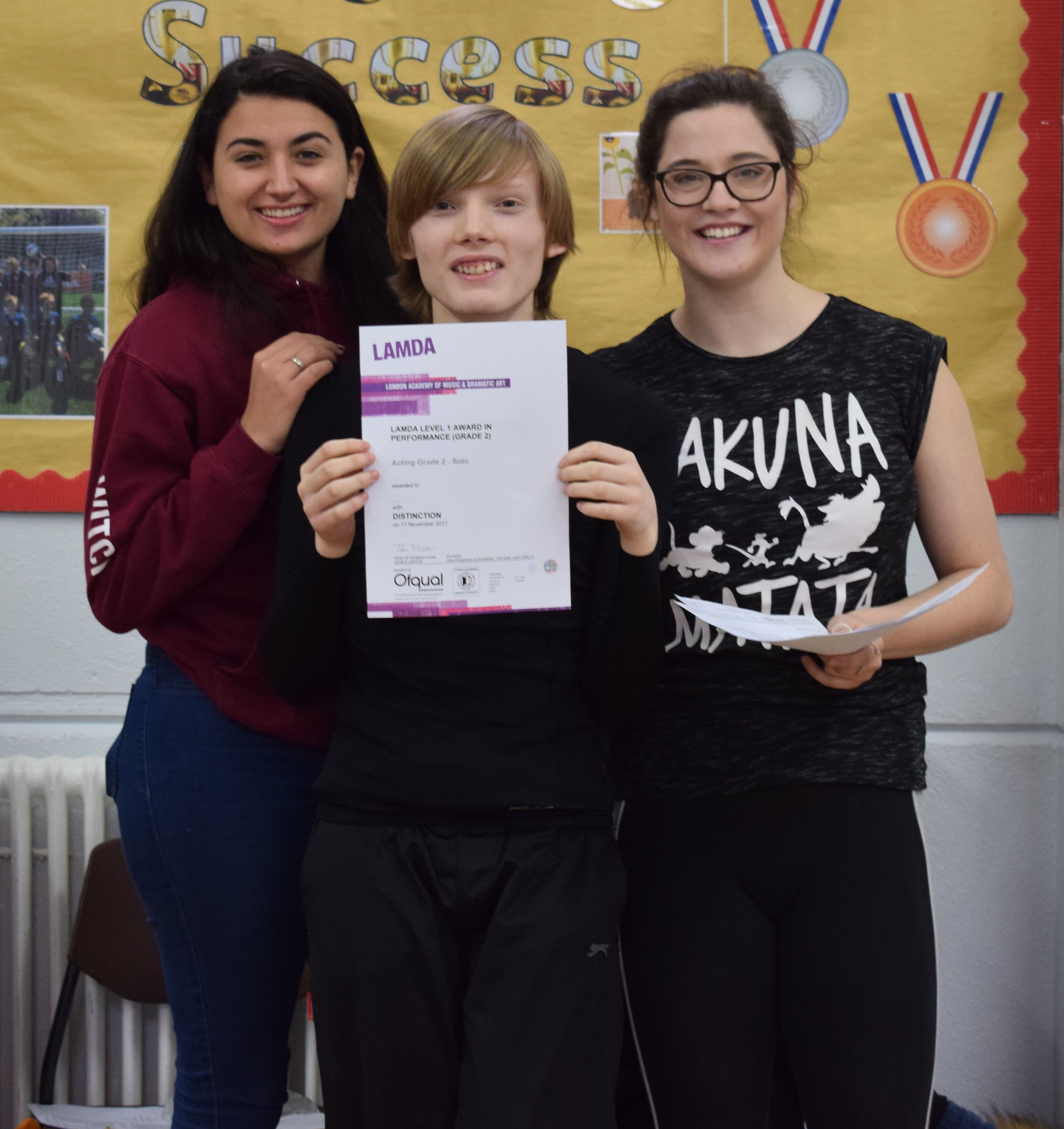 Picture of a boy with his LAMDA certificate